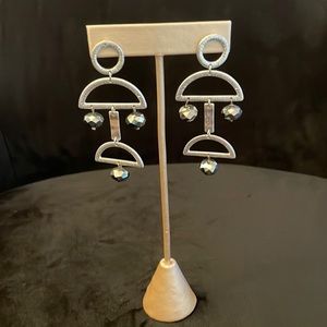 Brand new silver dangly earrings; 2.75 inches
